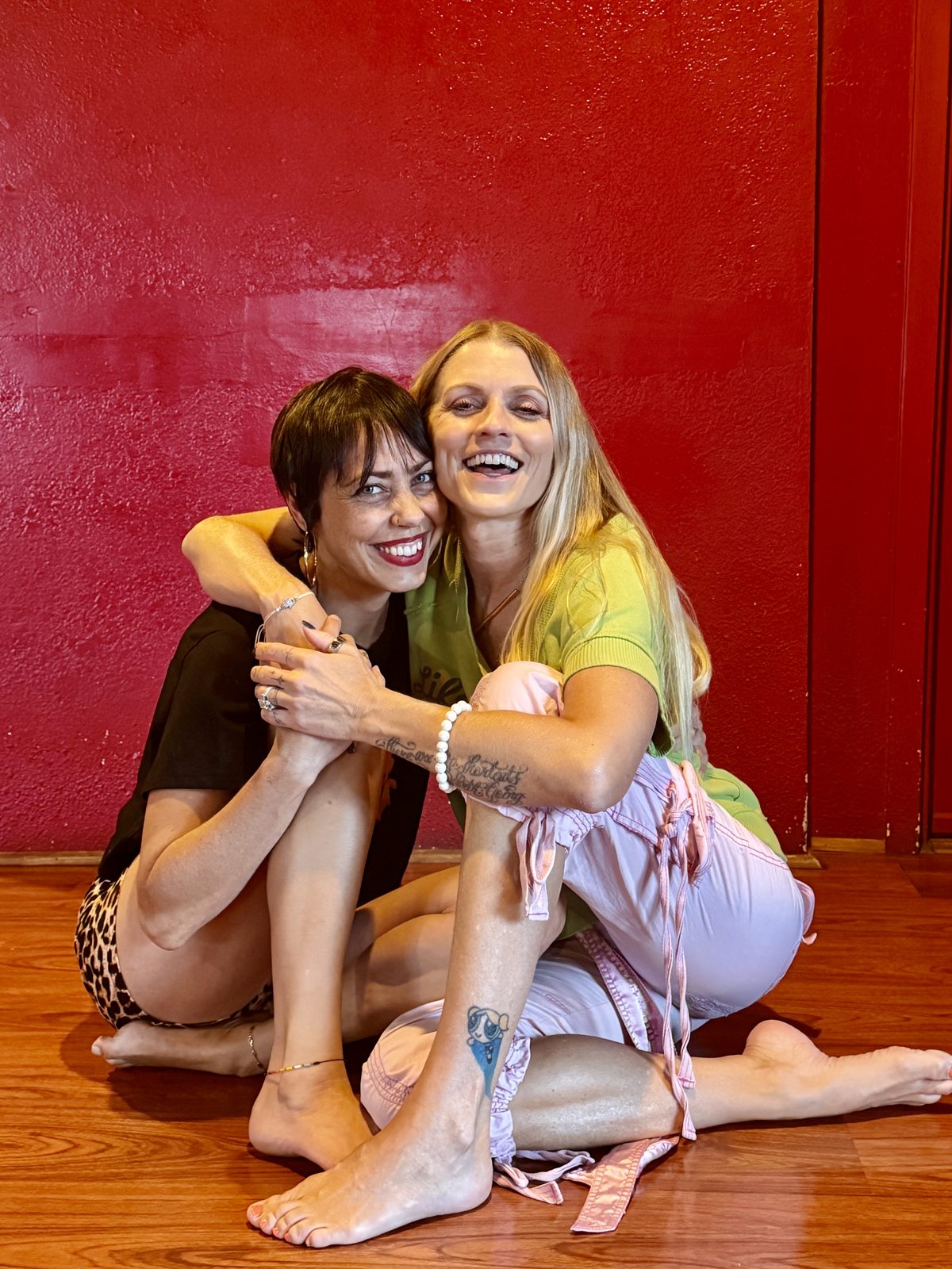 Melissa and Fawnia sitting together, smiling